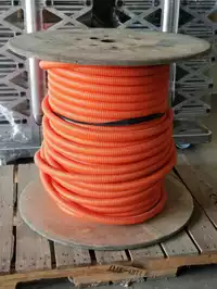 Image of Reel Of Orange Corrugated Plastic Tubing