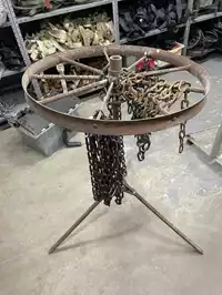 Image of Antique Metal Wheel On Stand