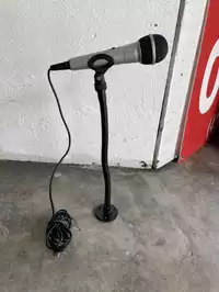 Image of Black Handheld Microphone On Stand