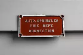 Image of Red Metal Info Fire Dept. Sign