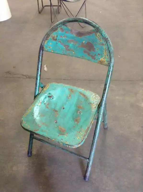 Image of Aged Teal Folding Chair