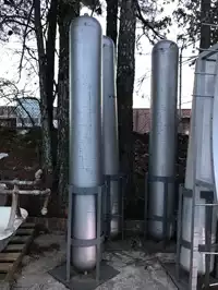 Image of Tall Cylinder Tank In Stand