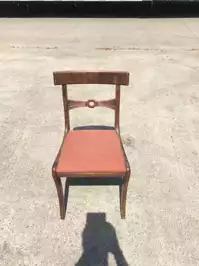 Image of Orange Cushioned Wooden Chair