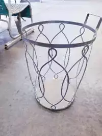 Image of Ornate Metal Firewood Basket