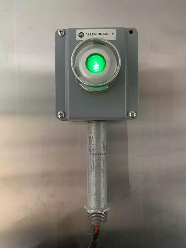 Image of Green Lit Button On Metal Box